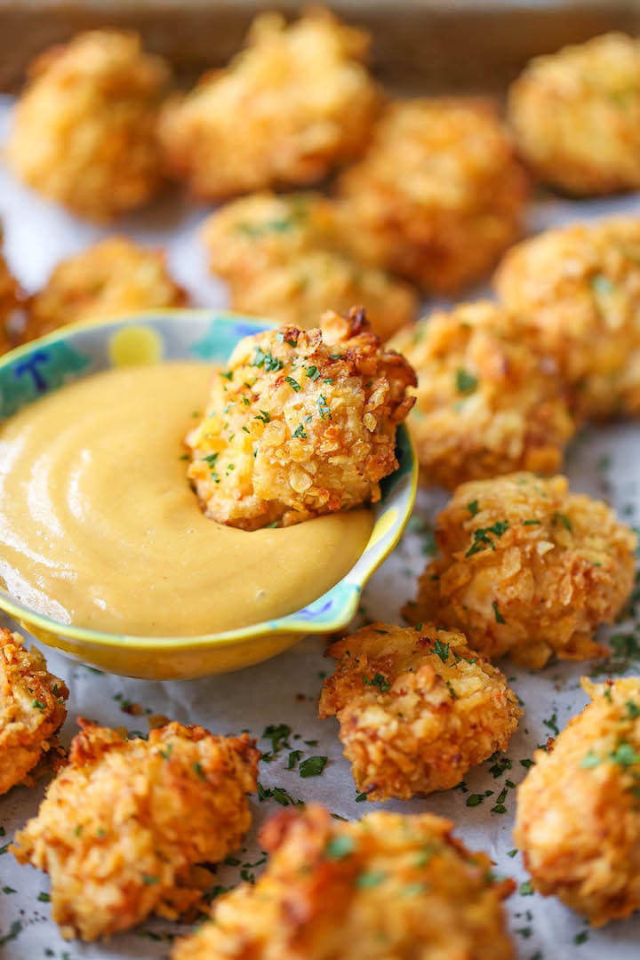 Baked Popcorn Chicken - A healthier alternative to the deep-fried version with the best crispy potato chip crust!! No one will believe that this is baked!