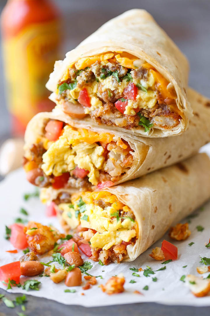 Freezer Breakfast Burritos - Meal prep over the weekend for the best burritos during the week. Loaded with tater tots, eggs, beans and cheese, of course!!