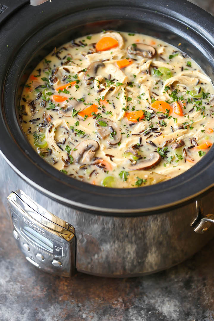 Slow Cooker Chicken and Wild Rice Soup - Pure creamy comfort food made right in your crockpot! So quick, easy, and hearty with veggies, rice and chicken!