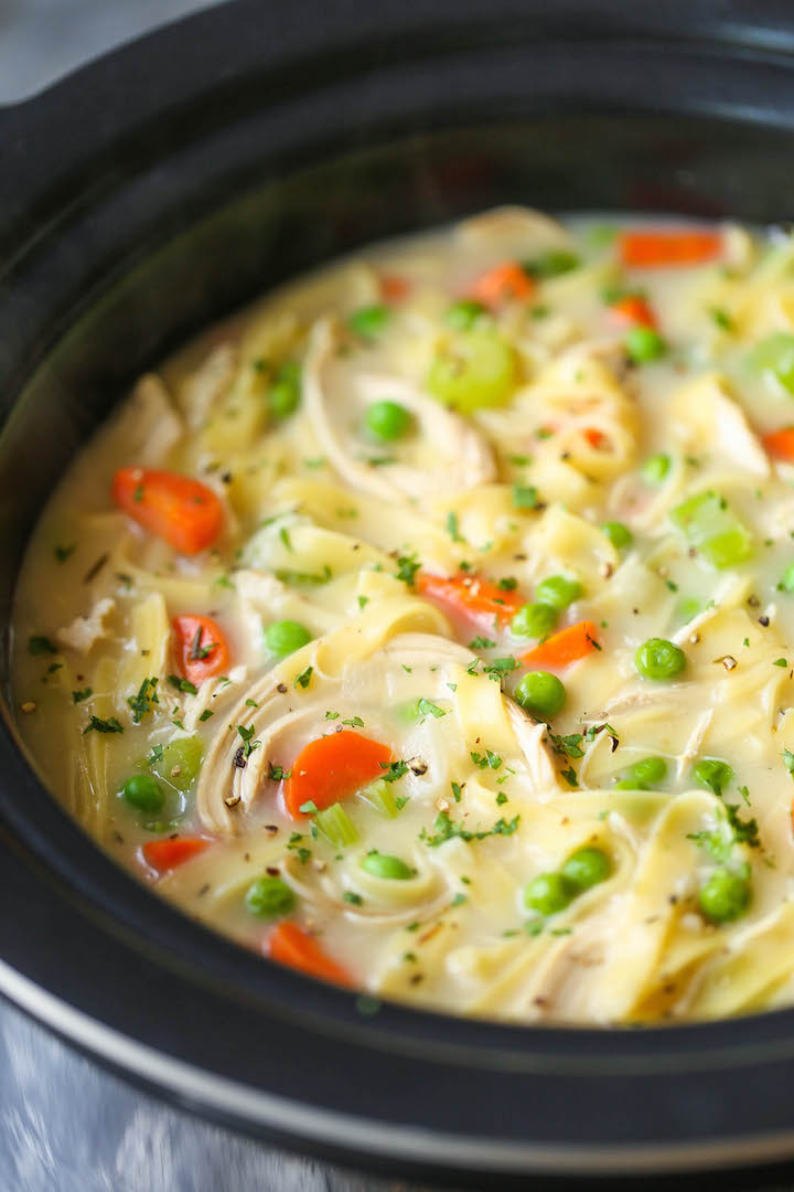 Slow Cooker Creamy Chicken Noodle Soup - The creamiest chicken noodle soup ever! Made effortlessly in your crockpot. Even the pasta gets cooked right in!