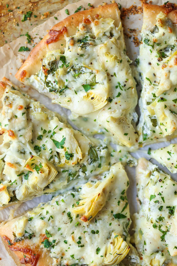 Spinach and Artichoke Dip Pizza - Everyone's favorite classic dip is turned into a pizza! It's so cheesy, utterly creamy and melt-in-your-mouth AH-MAZING!