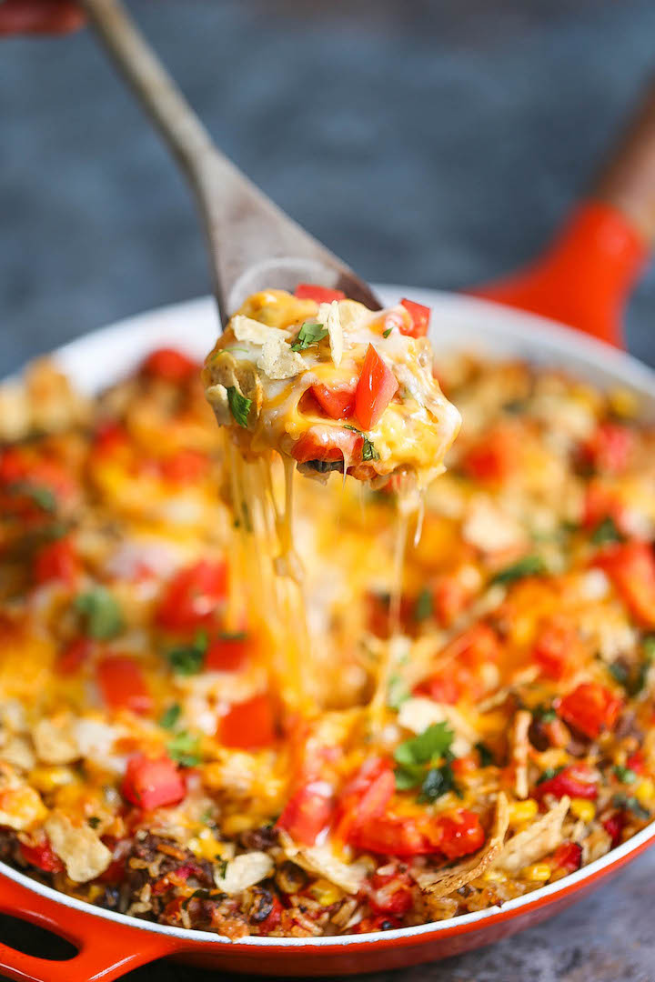 One Pot Nacho Beef Skillet - A 30 minute ground beef skillet dinner where you only need to dirty up ONE PAN! With corn, tomatoes, bell peppers and cheese!