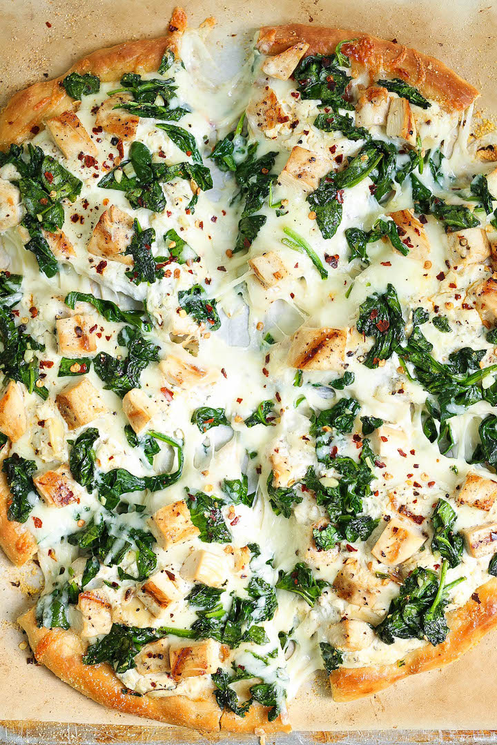 Roasted Garlic, Chicken and Spinach White Pizza - So amazingly cheesy with just the right amount of garlic. You can save the leftover garlic for later use!