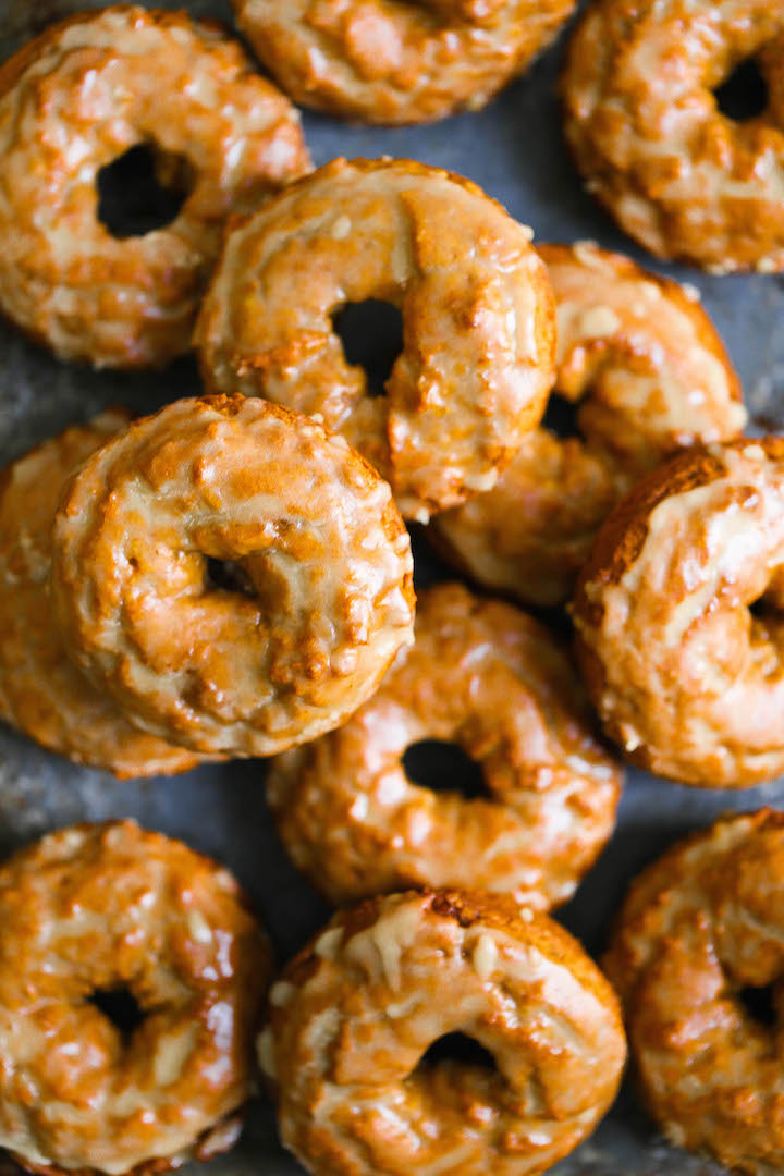 Baked Pumpkin Donuts with Maple Glaze - These are the best Fall pumpkin donuts ever.  So soft, so crumbly and so perfectly smothered in a warm maple glaze!
