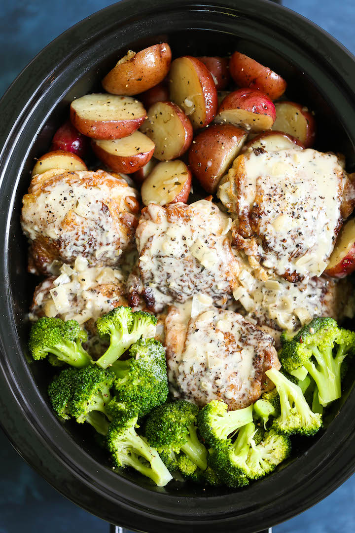 Slow Cooker Creamy Garlic Chicken and Veggies - A one pot crockpot meal! Tender chicken, potatoes and broccoli! Served with the creamiest garlic sauce ever!