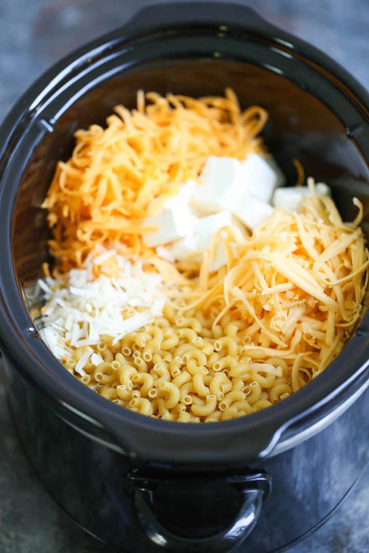 Slow Cooker Four Cheese Mac and Cheese - The BEST mac and cheese EVER!!!! No boil. No stress. Everything gets thrown right in. Even the uncooked noodles!!!
