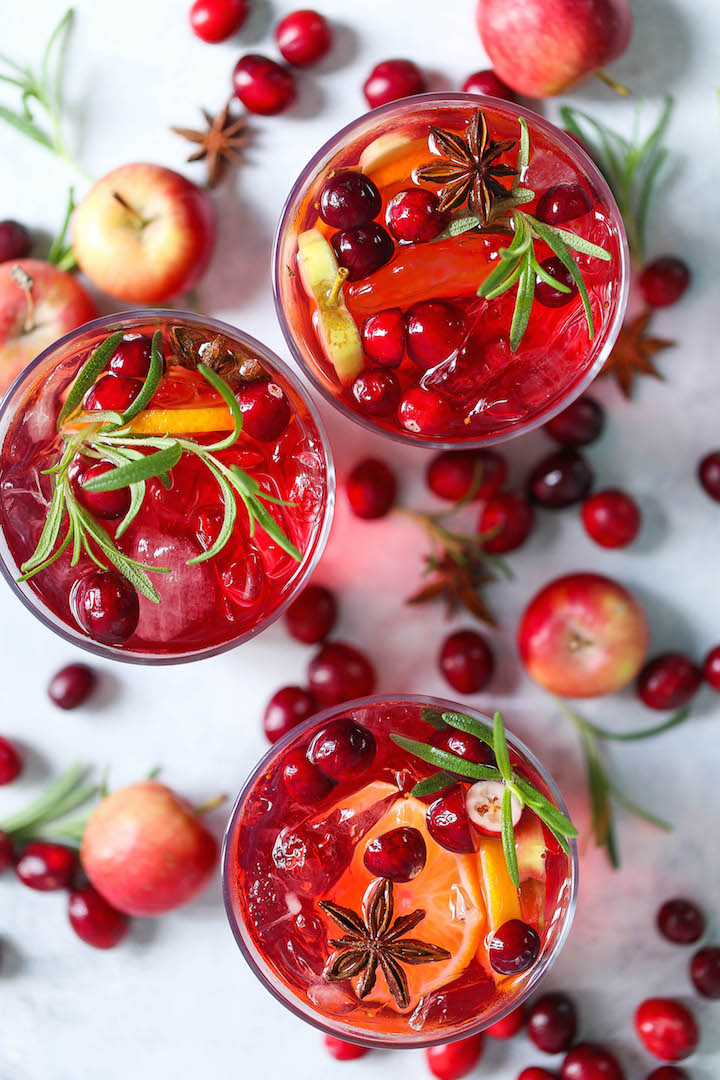 Cranberry Apple Sangria - The must have spiced holiday cocktail! With cranberries, apples, oranges, cinnamon and cloves! You can make this ahead of time!