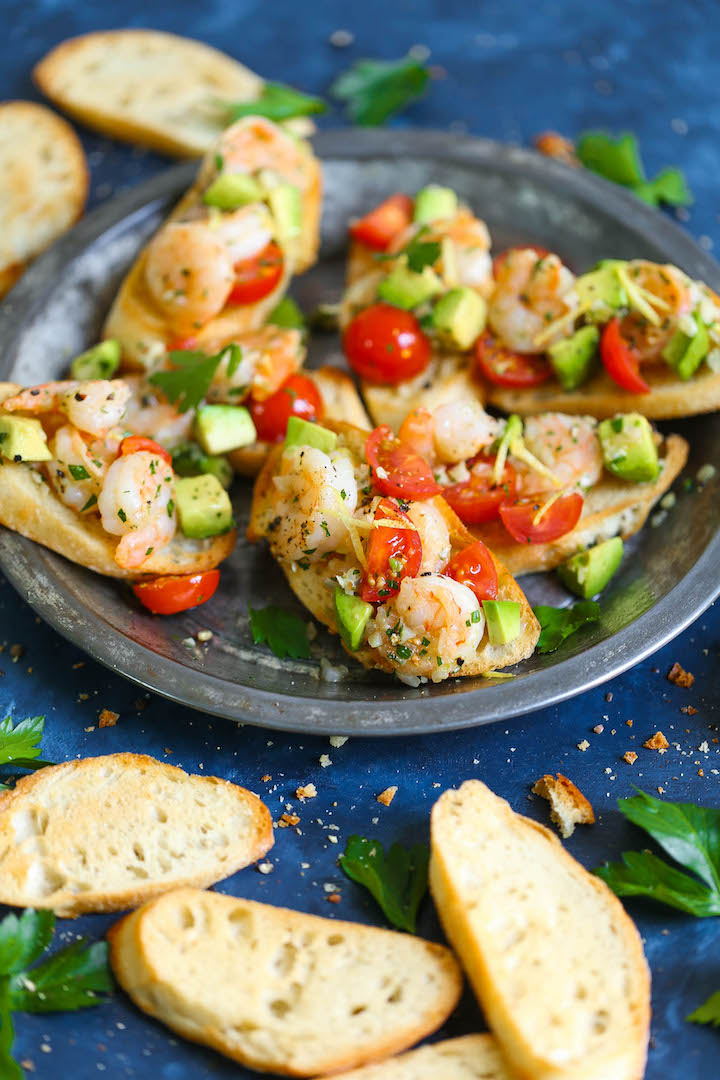 Garlic Shrimp and Avocado Crostini - The quickest and easiest appetizer you can whip up that is sure to be a crowd-pleaser! Everyone will beg for seconds!