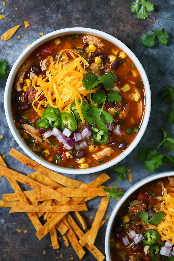 Chicken and Quinoa Tortilla Soup - Everyone's FAVORITE chicken tortilla soup, except made healthier and heartier with added quinoa. This cozy soup is full of fiber and protein to keep you full all day long! You can also add the easiest homemade crispy BAKED tortilla strips!