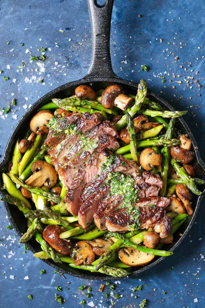 One Pan Steak and Veggies with Garlic Herb Butter - Perfectly seasoned and cooked steak with asparagus and mushrooms, served with a heavenly garlic herb butter! One pan. Minimal clean-up. 30 minutes. That's it!