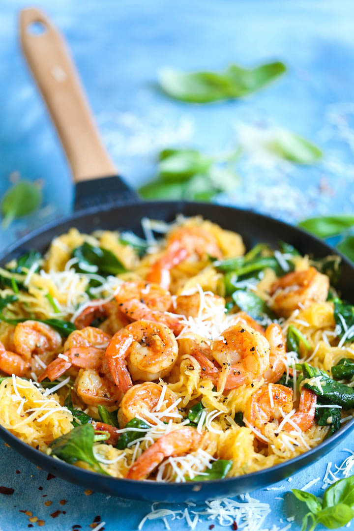 Shrimp Scampi Spaghetti Squash - Everyone's favorite shrimp scampi with a low-carb, healthier alternative to pasta using spaghetti squash! It's still amazingly buttery and garlicky with half the calories!