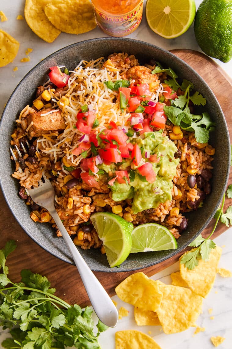 Instant Pot 20 Minute Chicken Burrito Bowls - Comes together in less than 10 min prep! The chicken is so tender and the flavors are so good.