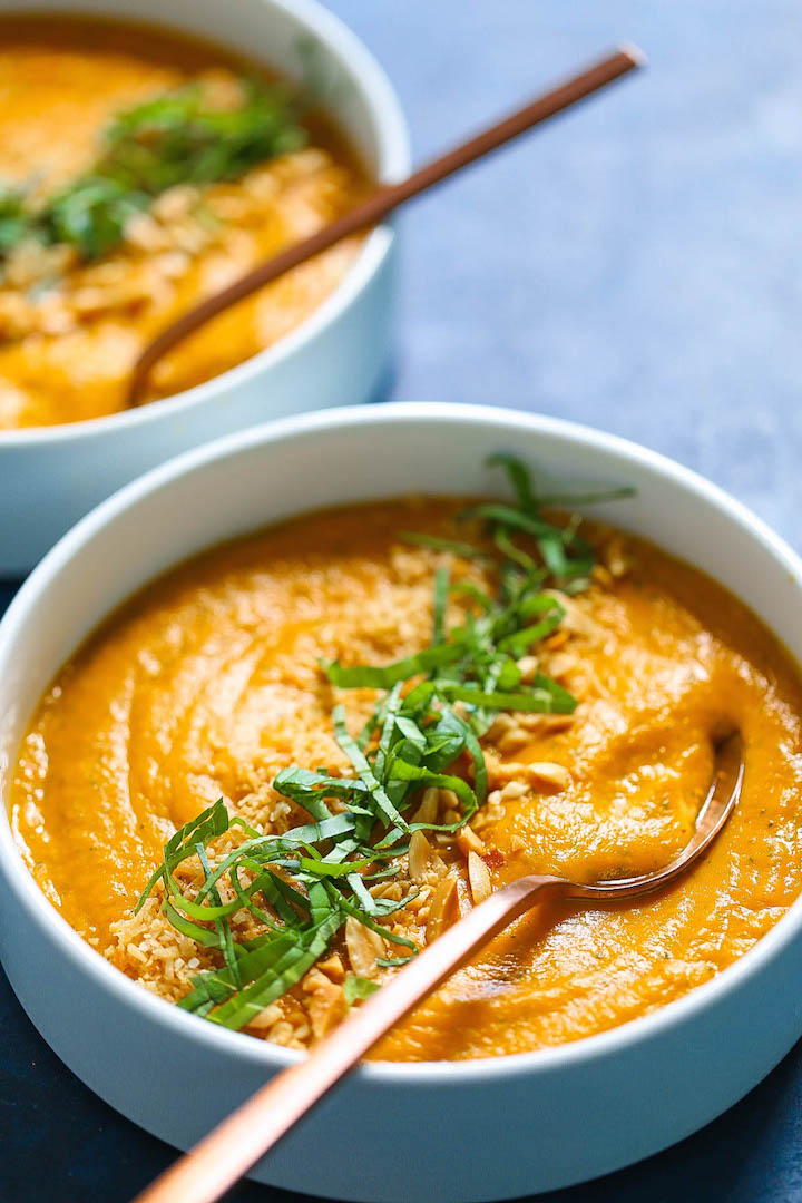 Thai Sweet Potato and Carrot Soup - A Thai-inspired soup that is incredibly light, healthy, hearty and cozy! It is so easy to make using baby carrots, sweet potatoes, lite coconut milk and lime juice. It is packed with SO MUCH FLAVOR!