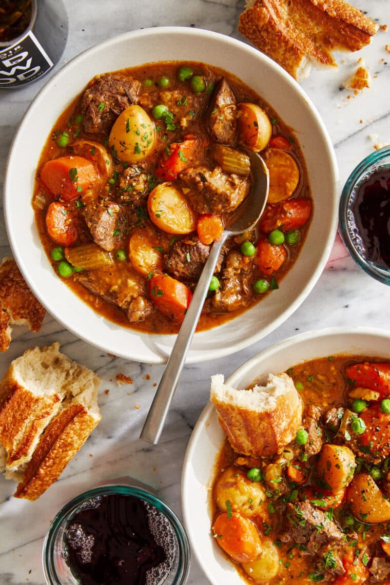 Instant Pot Beef Stew - Loaded with flavorful chunks of meat + potatoes that come out amazingly tender. Truly the BEST beef stew recipe ever!