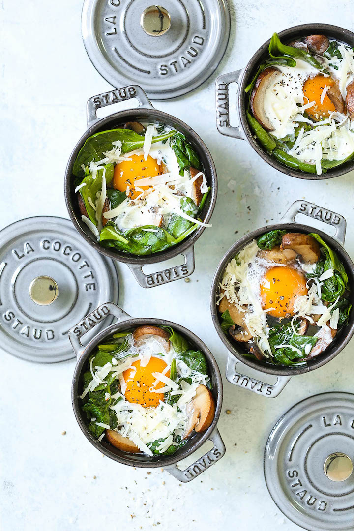 Baked Eggs with Mushrooms and Spinach - Easy peasy individual baked eggs with garlicky sautéed mushrooms and wilted spinach. Healthy, hearty and quick! Serve for breakfast, lunch or dinner with lots of buttered toast! Great for guests or for individual servings.