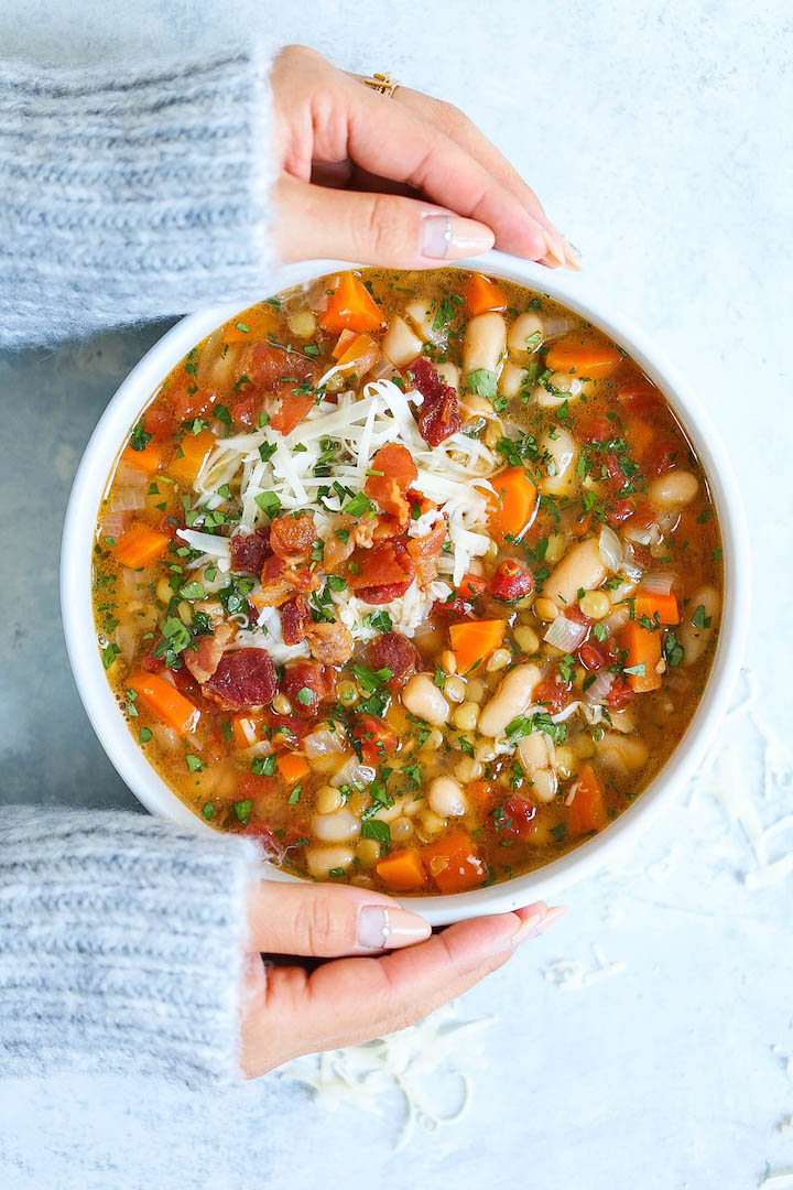 Hearty Lentil and White Bean Soup - So hearty, healthy and easy with just 213 calories per serving! You can also make this on any given weeknight, and the leftovers reheat very well! With the Parmesan rinds, this soup is bursting with just so much flavor!