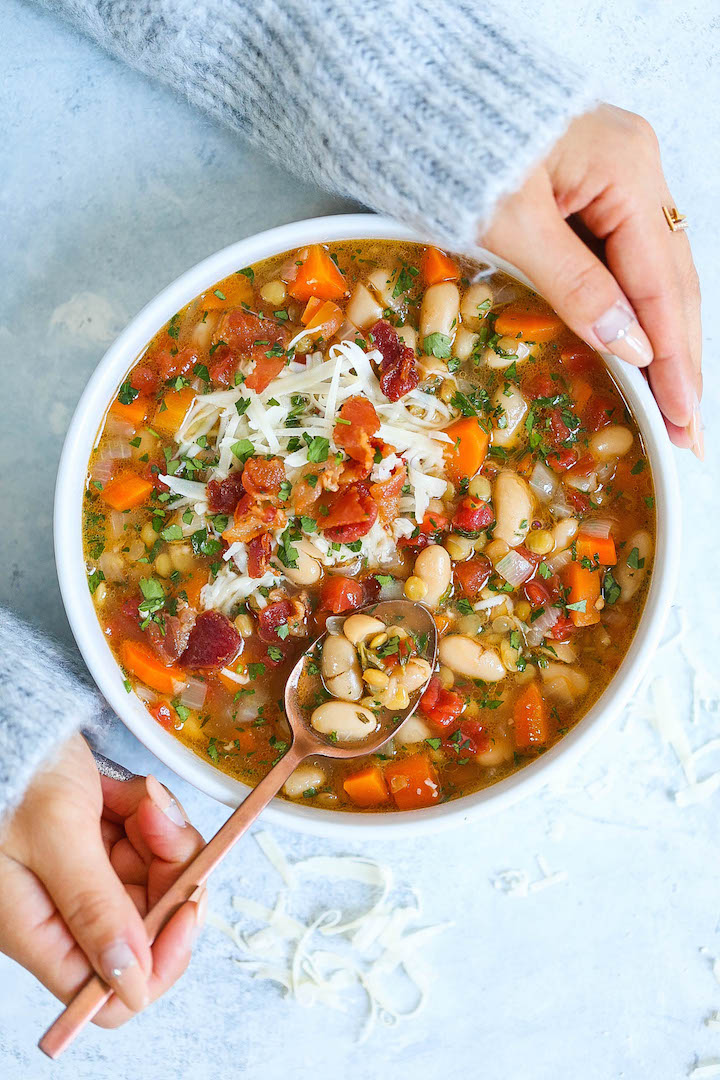 Hearty Lentil and White Bean Soup - So hearty, healthy and easy with just 213 calories per serving! You can also make this on any given weeknight, and the leftovers reheat very well! With the Parmesan rinds, this soup is bursting with just so much flavor!
