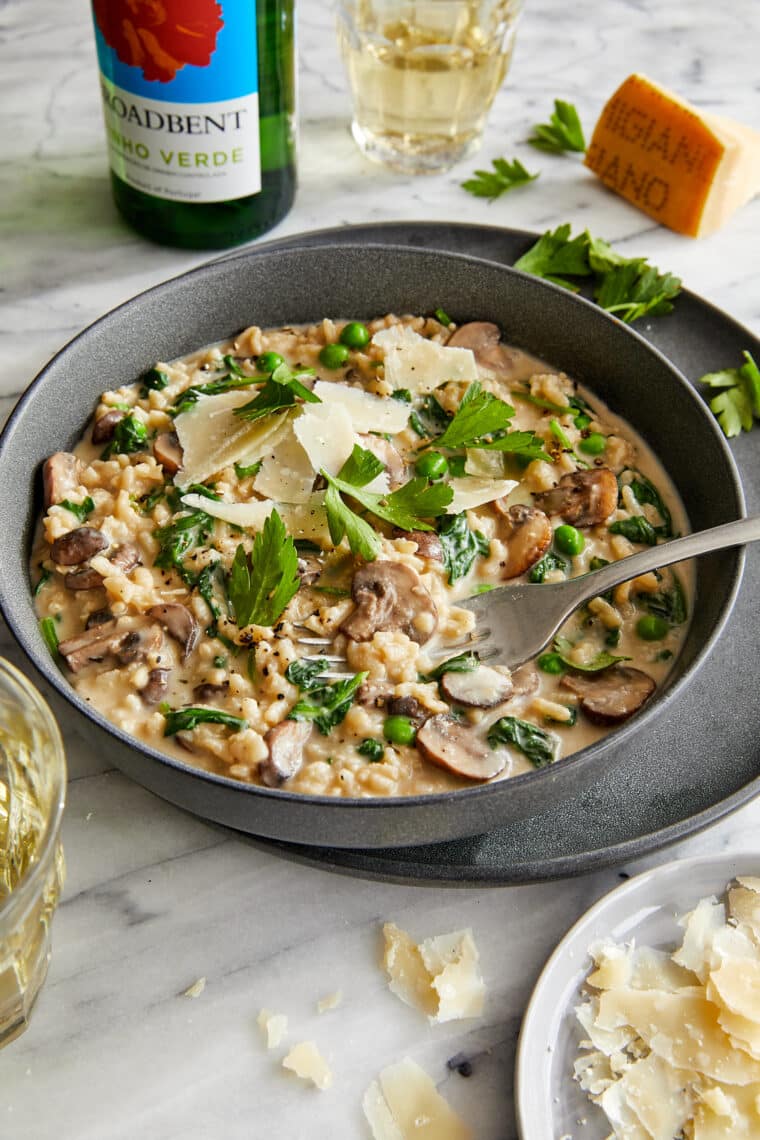 Instant Pot Mushroom Risotto - Truly the EASIEST no-fuss risotto! Amazingly rich + creamy, loaded with mushrooms, spinach, peas and Parmesan!