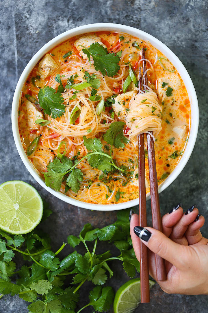 Thai Red Curry Noodle Soup - Yes, you can have Thai takeout right at home! This soup is packed with so much flavor with bites of tender chicken, rice noodles, cilantro, basil and lime juice! So cozy, comforting and fragrant - plus, it's easy enough for any night of the week!