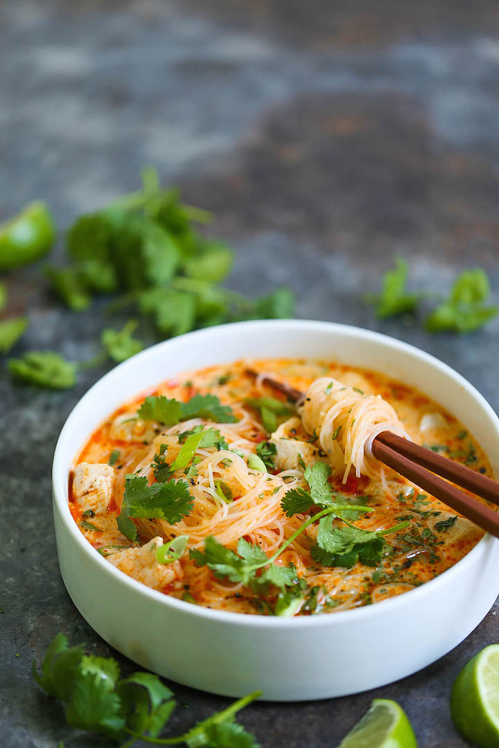 Thai Red Curry Noodle Soup - Yes, you can have Thai takeout right at home! This soup is packed with so much flavor with bites of tender chicken, rice noodles, cilantro, basil and lime juice! So cozy, comforting and fragrant - plus, it's easy enough for any night of the week!