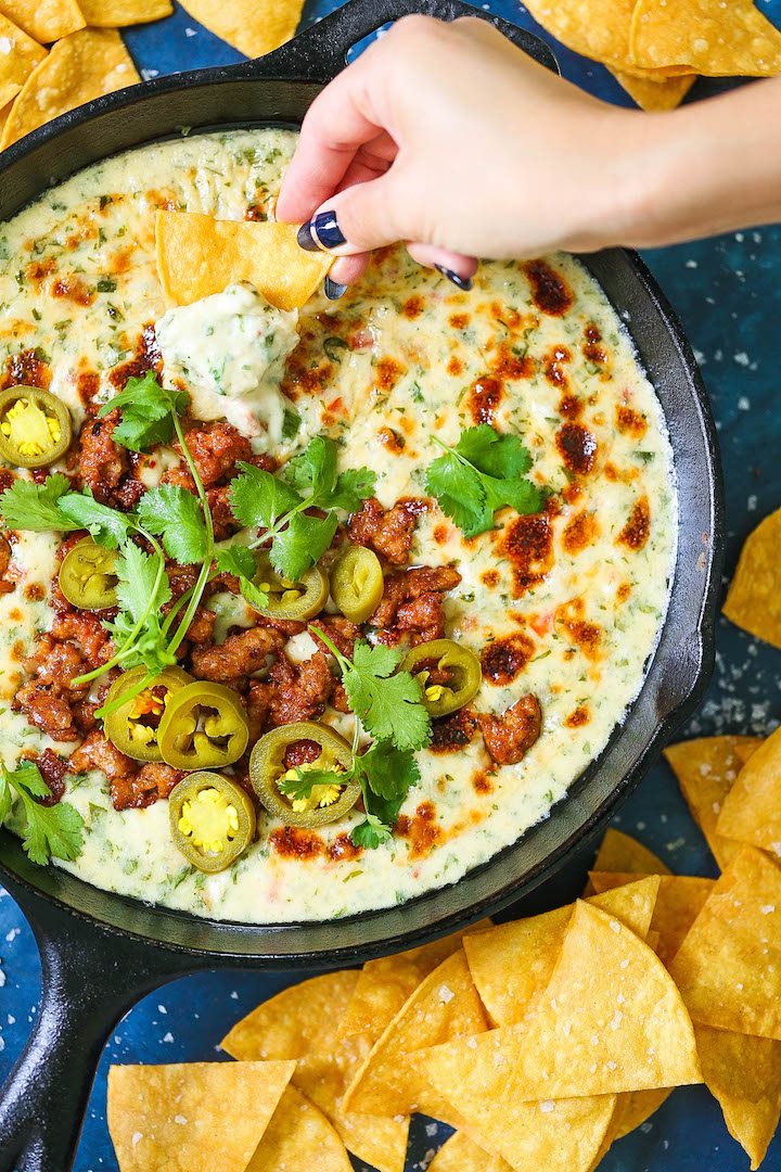 Creamy Chorizo Queso Dip - The CREAMIEST, most velvety queso EVER! Serve with tortilla chips and extra chorizo + cilantro on top! SO SO GOOD.