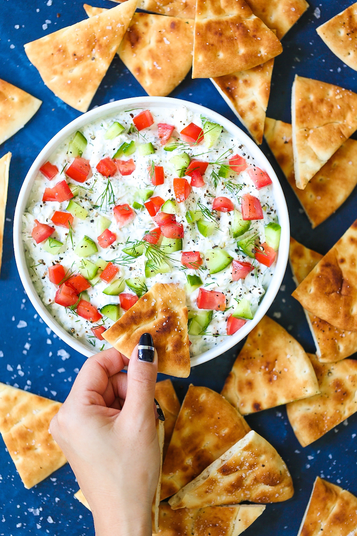 Creamy Greek Feta Dip - Such a simple yet creamy, satisfying dip that everyone will go crazy for! Takes just 15 minutes (or less) to whip up using feta, cream cheese, Greek yogurt, lemon juice and fresh herbs! You can even make this ahead of time and chill for up to 2 days! Serve with pita chips.