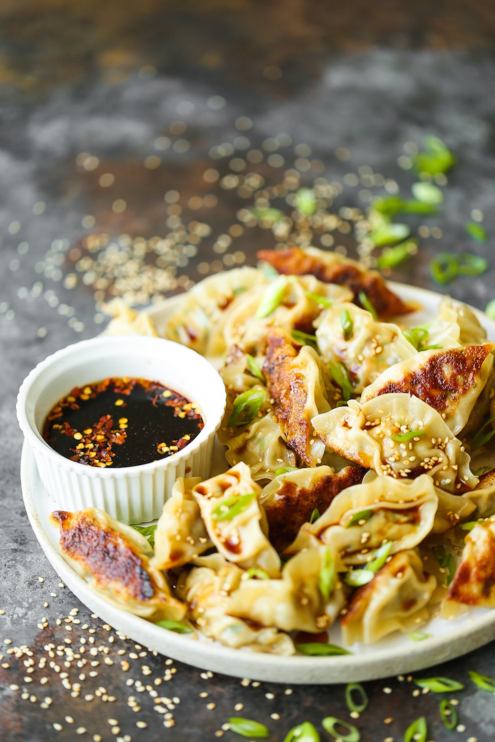 Garlic Ginger Chicken Potstickers - Homemade potstickers are easier to make than you think! Plus, they are cheaper and tastier than take-out or store-bought. Best of all, you can make these ahead of time and freeze so you can have these anytime, anywhere!