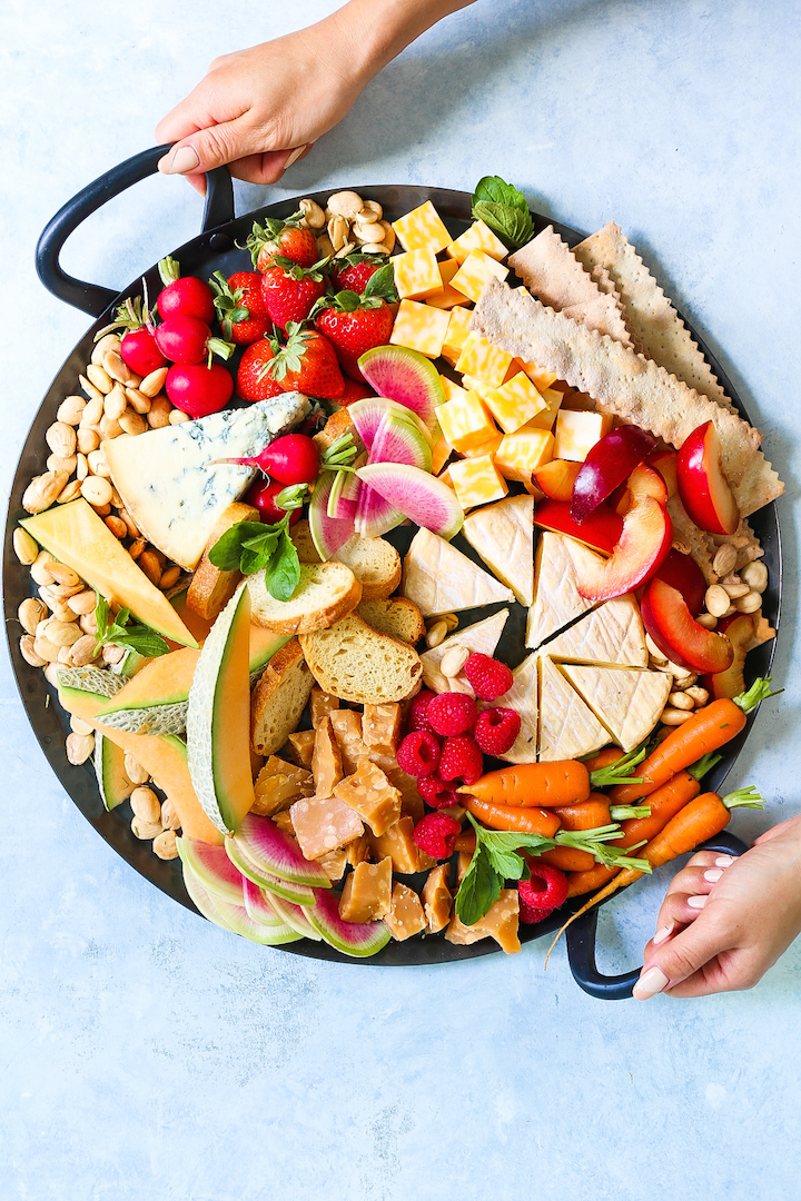 Spring Cheese Board - How to build the most PERFECT cheese board! Perfect for entertaining and impressing your guests, this cheese board is assembled with so many of our favorite Spring fruits and veggies!