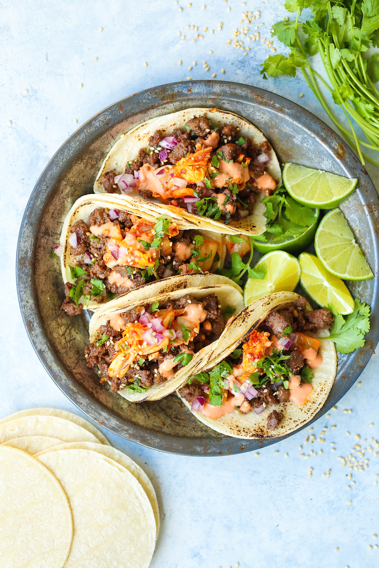 Korean Beef Tacos - The most mind-blowing tacos EVER! Filled with everyone's favorite Korean beef, caramelized kimchi + Sriracha mayo!