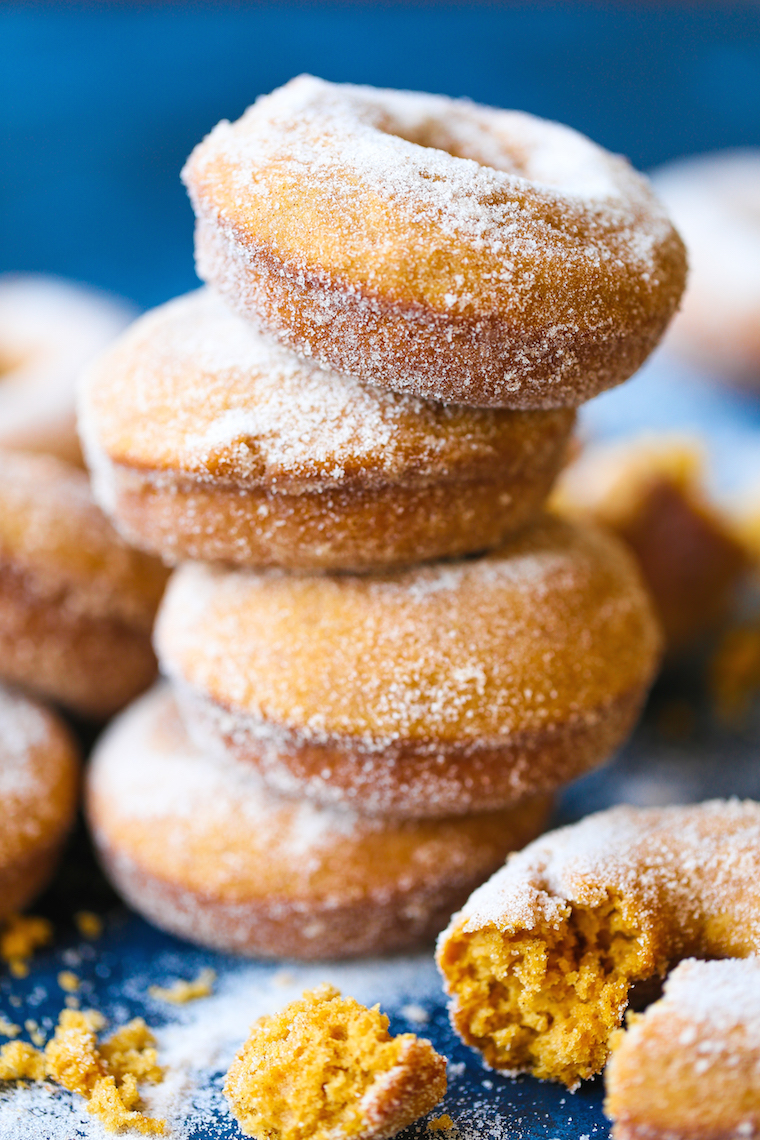 Pumpkin Cake Donuts - The MOST HEAVENLY pumpkin donuts! So moist, they just melt-in-your mouth! Coated in melted butter and cinnamon sugar. It's perfection!