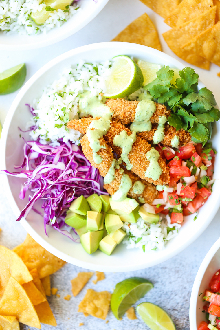 Fish Taco Bowls - The best weeknight meal! With perfectly cooked fish, cilantro lime rice, pico de gallo, avocado, and THE MOST epic cilantro lime dressing!