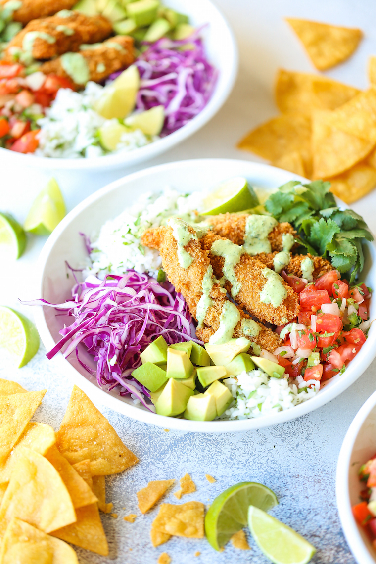 Fish Taco Bowls - The best weeknight meal! With perfectly cooked fish, cilantro lime rice, pico de gallo, avocado, and THE MOST epic cilantro lime dressing!