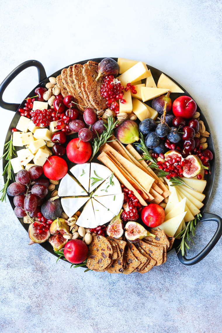 Holiday Cheese Board - The most EPIC appetizer board ever! With an assortment of cheeses, figs, nuts, and pomegranate, this is the must-have holiday recipe!