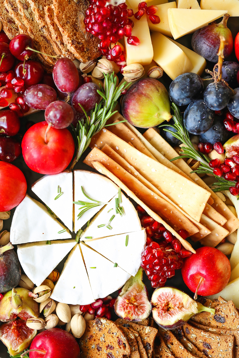 Holiday Cheese Board - The most EPIC appetizer board ever! With an assortment of cheeses, figs, nuts, and pomegranate, this is the must-have holiday recipe!