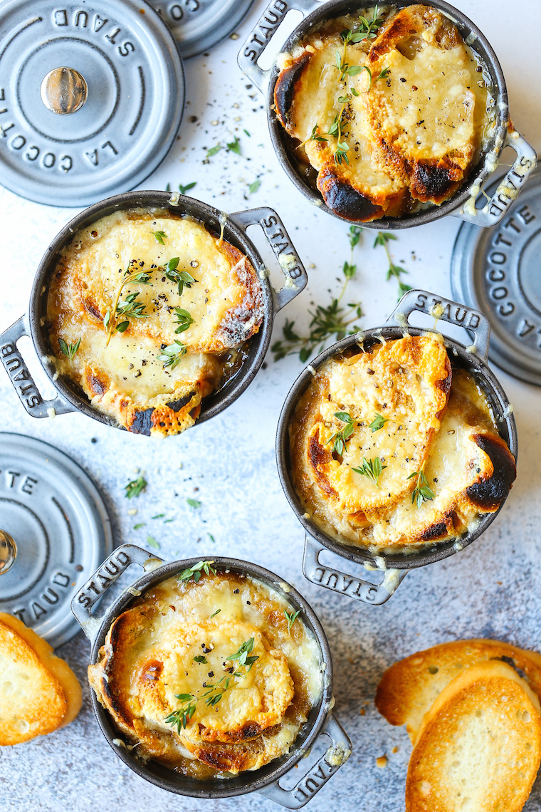 Classic French Onion Soup - Made with perfectly caramelized onions, fresh thyme sprigs, crusty baguette slices and two types of melted cheese right on top!