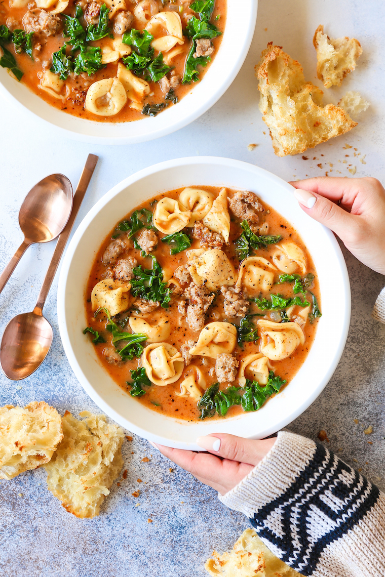 Creamy Tortellini Soup - My favorite cozy weeknight soup made in just 30 min! It's so stinking easy too. Loaded with tender tortellini, sausage and kale!