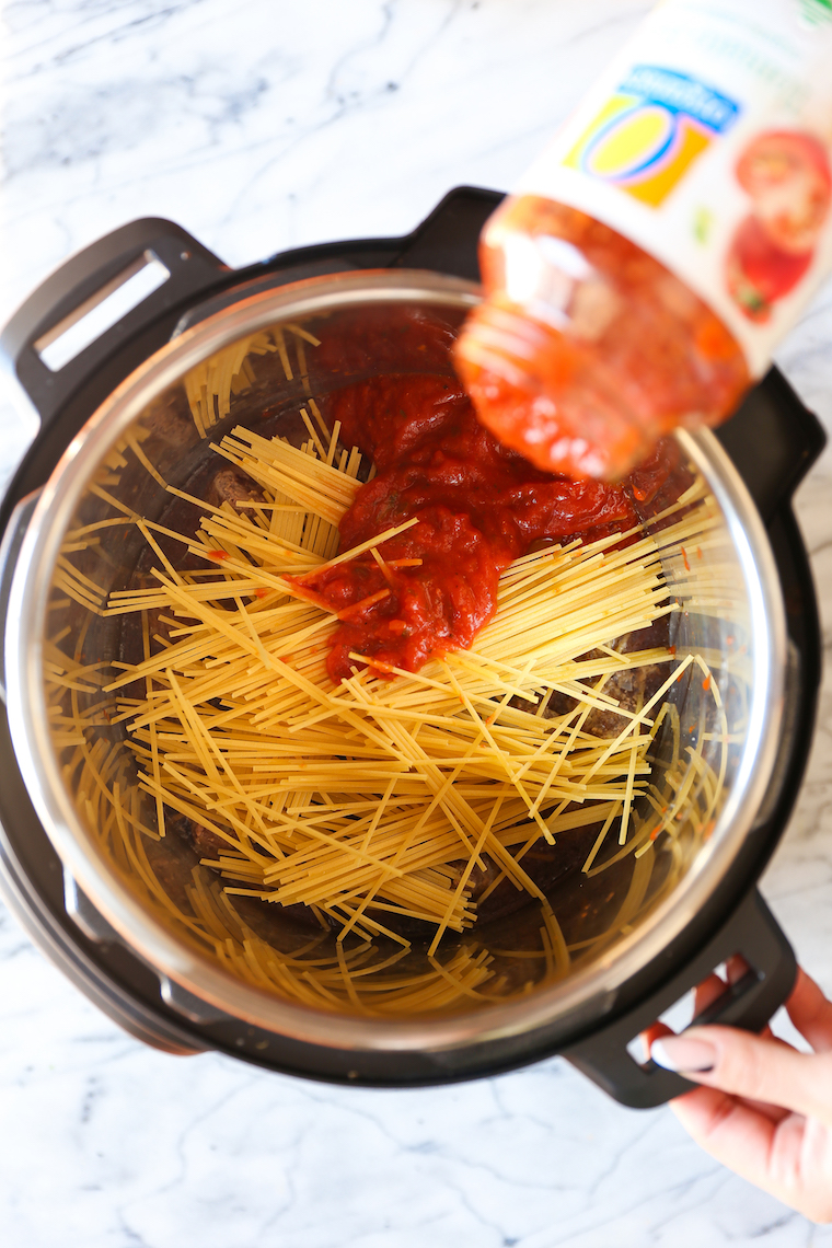 Instant Pot Spaghetti and Meatballs - A ONE POT meal made in your pressure cooker with homemade meatballs (not frozen!). Still so quick and easy to whip up!