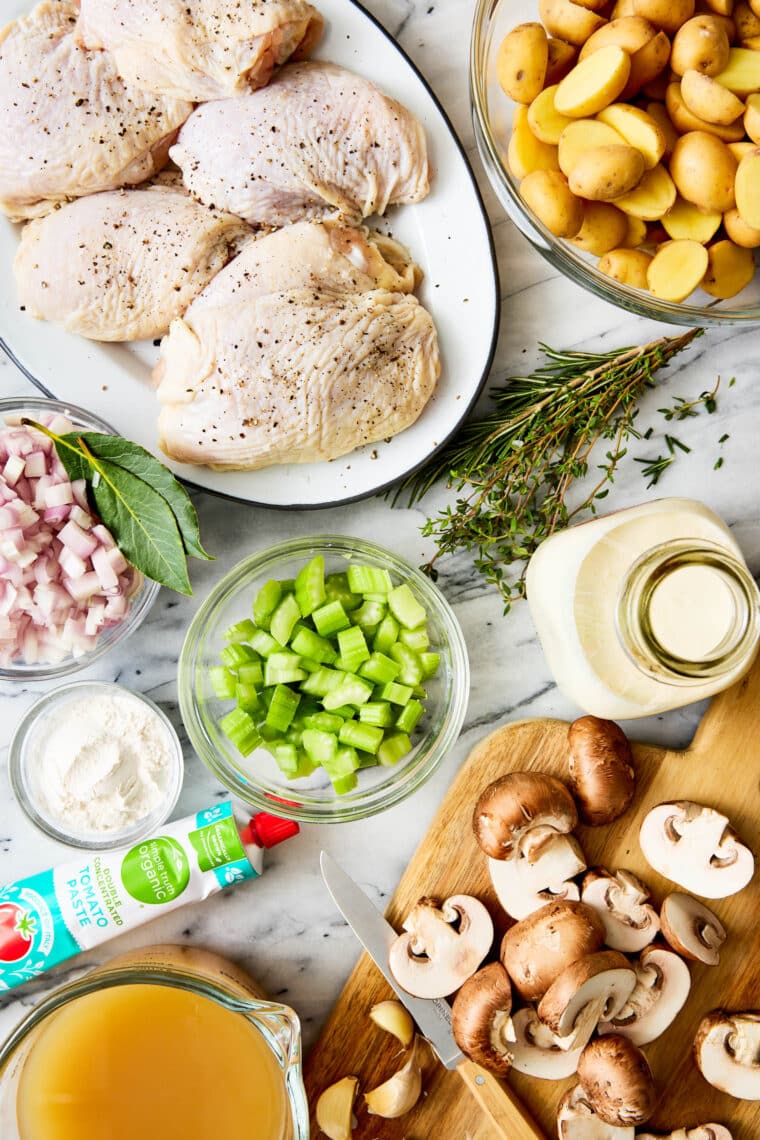 French Chicken Casserole - The coziest, most wholesome meal. With golden brown chicken, tender potatoes, white wine, fresh rosemary + thyme.