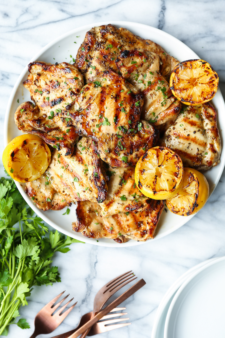 Lemon Garlic Chicken Thighs - Olive oil, lemon juice/zest, garlic, Dijon, oregano, thyme. THE BEST marinade ever. Made on the grill or stovetop. SO SO GOOD.