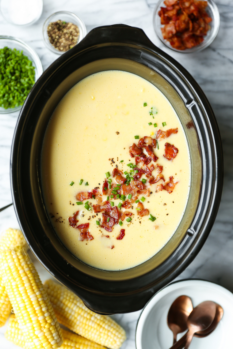 Slow Cooker Corn Chowder - The easiest crockpot soup ever! Fresh corn kernels, bacon, potato, stock, garlic, thyme. Topped with crisp bacon bits and chives. THE BEST.