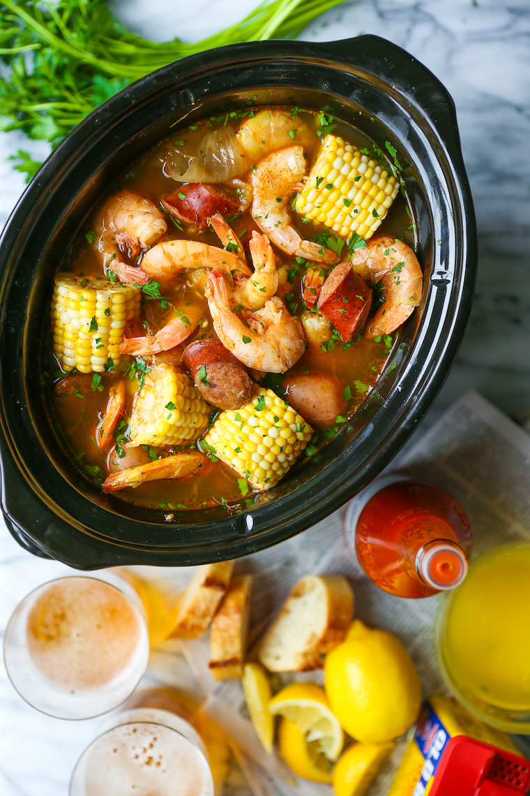 Slow Cooker Shrimp Boil - Red potatoes, andouille sausage, shrimp, corn, Old Bay. A classic shrimp boil made without any of the fuss right in your crockpot!