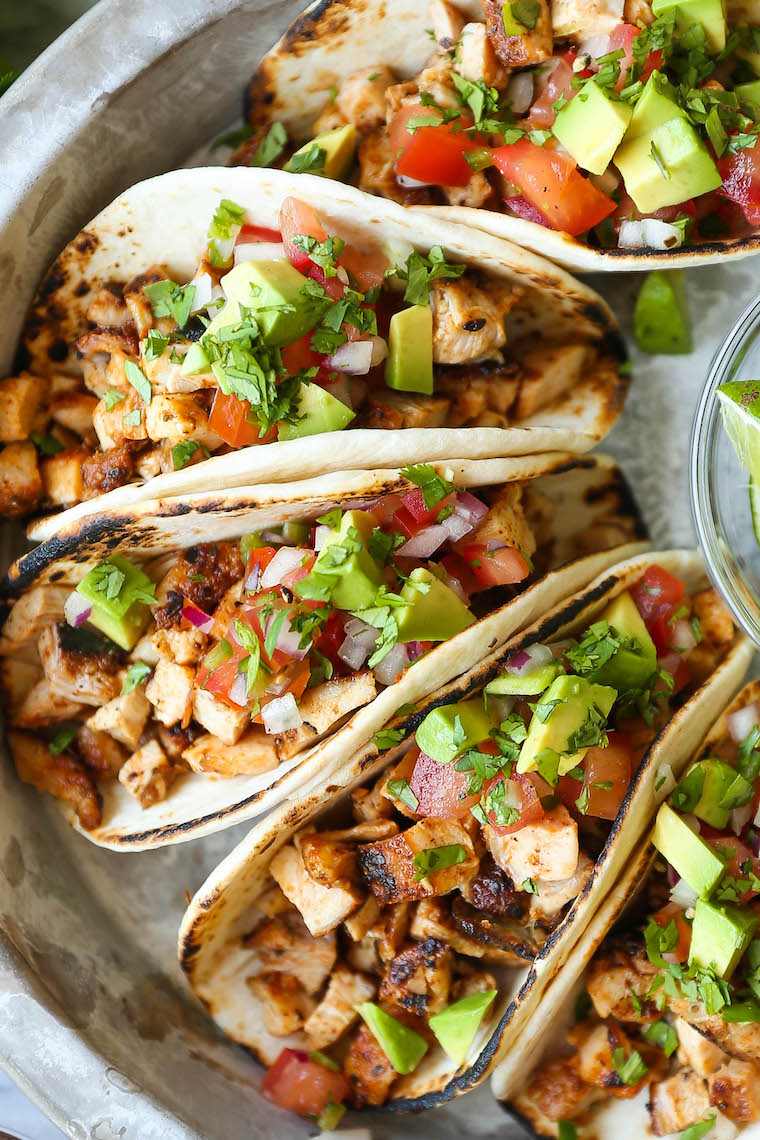 Easy Chicken Tacos - With a simple spice rub, the chicken is cooked quickly on the stovetop! Serve with pico de gallo, avocado + lime wedges!