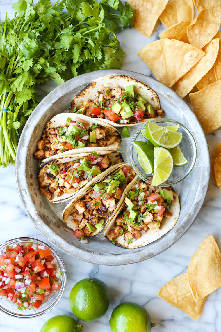 Easy Chicken Tacos - With a simple spice rub, the chicken is cooked so quickly on the stovetop! Dice into small pieces and serve with pico, avocado + lime!