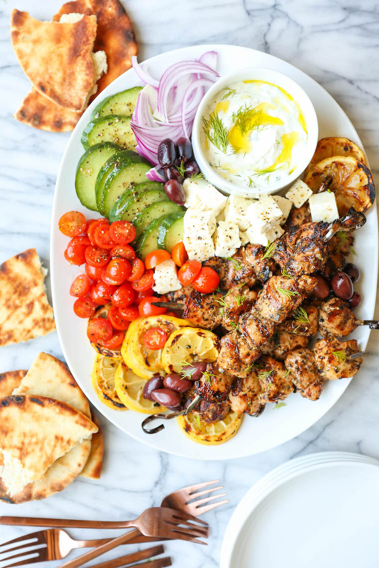 Greek Chicken Kabobs - Super juicy, tender kabobs made with the best marinade ever! Olive oil, lemon juice, paprika, oregano, basil, thyme, garlic. SO BOMB.