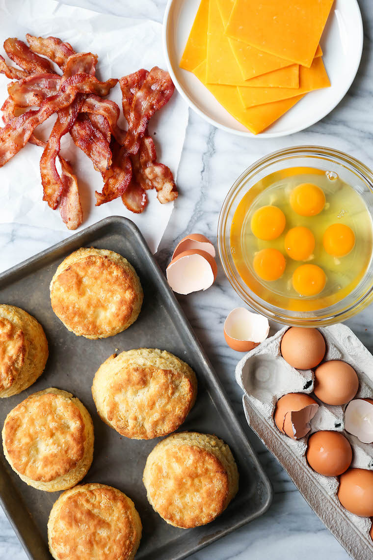 Make Ahead Breakfast Biscuit Sandwiches - Oh-so-warm, flaky buttermilk biscuits with eggs, bacon and cheese. Store in the fridge and reheat in the morning!