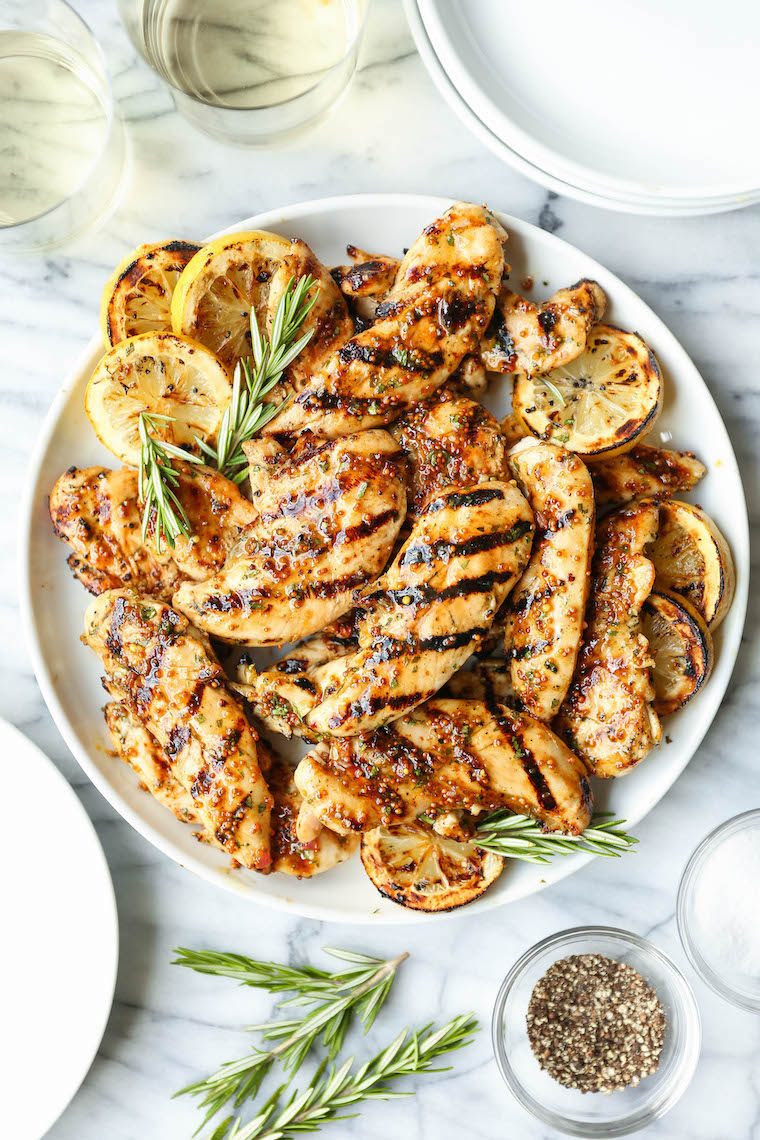 Grilled Honey Mustard Chicken Tenders - The most juicy, tender chicken with the easiest marinade. Dijon, honey, olive oil, rosemary, lemon. THE BEST EVER.