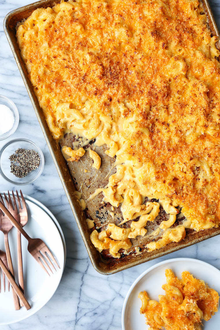 Sheet Pan Mac and Cheese - Crowd-pleasing mac and cheese made on a sheet pan! Perfectly cheesy + creamy with the maximum amount of crunchy bits. MIND BLOWN.