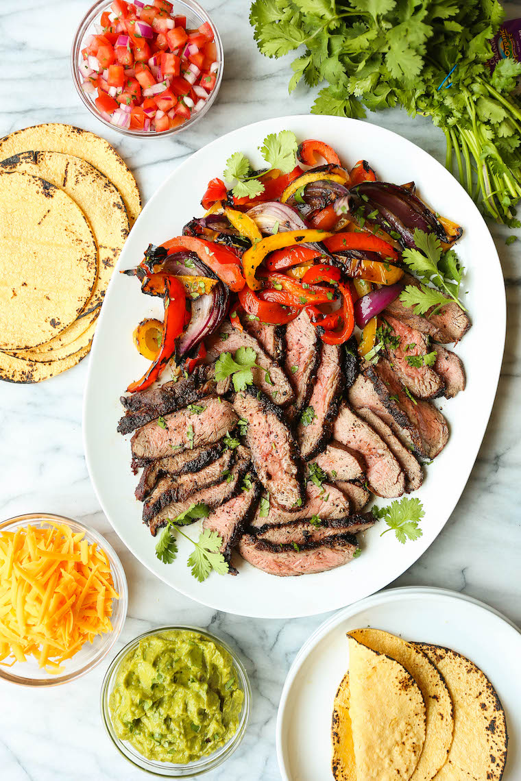 Easy Steak Fajitas - Tender, juicy, melt-in-your-mouth slices of steak with bell peppers and onion. SO SO GOOD. Serve with tortillas, pico and guacamole.