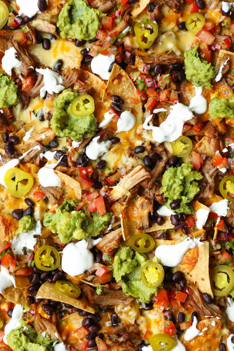 Instant Pot Pulled Pork Nachos - Crowd-pleasing, fully-loaded nachos with the most amazing melt-in-your-mouth, juicy shredded pork. So tender, so good!