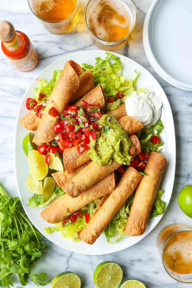 Quick Chicken Taquitos - Such a great way to use up leftover rotisserie chicken! So easy, crispy and crunchy! Serve with guac, pico de gallo and sour cream!